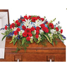 Red white and blue casket spray for a special tribute.
