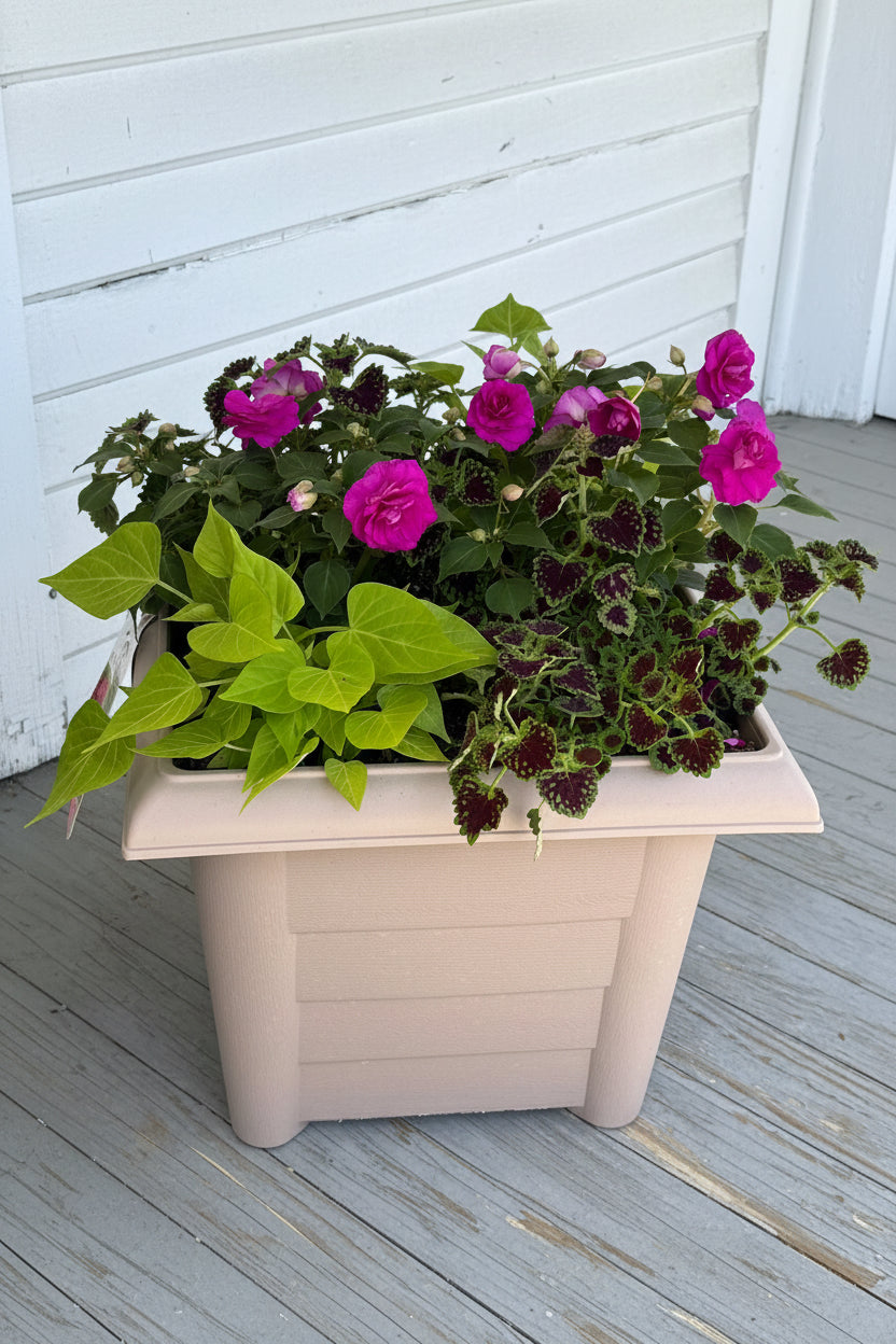 Floral arrangement in a decorative pot on a wooden surface