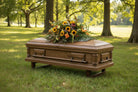 Floral arrangement with sunflowers and other flowers for a funeral or celebration of life service.